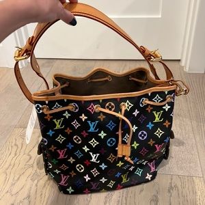 EXCELLENT almost perfect condition of a black and multicolor Petit Noe.